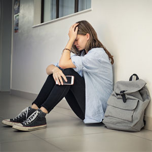 Distressed woman, social media risk